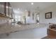 Bright kitchen with granite countertops, dark cabinetry, and stainless steel appliances at 1118 Avery Meadows Way, Deland, FL 32724