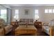 Bright living room featuring hardwood floors, recessed lighting, and an open floor plan at 1118 Avery Meadows Way, Deland, FL 32724