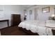 Comfortable main bedroom with wood floors, bright windows, and elegant furnishings at 1118 Avery Meadows Way, Deland, FL 32724
