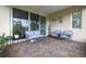Covered patio with brick pavers and comfortable outdoor seating area at 1118 Avery Meadows Way, Deland, FL 32724