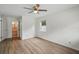 Bright bedroom features laminate flooring, ceiling fan, and natural light from one window at 1209 James Ter, Daytona Beach, FL 32117