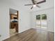 Dining area with wood floors, ceiling fan, and sliding glass door to the backyard at 1209 James Ter, Daytona Beach, FL 32117