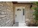Close-up of the front door featuring a modern design and house number at 1209 James Ter, Daytona Beach, FL 32117