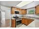 Bright kitchen with stainless steel appliances, wooden cabinets, and lots of counter space at 1209 James Ter, Daytona Beach, FL 32117