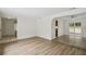 Open-concept living area with wood floors and easy access to kitchen and backyard at 1209 James Ter, Daytona Beach, FL 32117