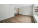 Bright living room with wood floors, arched doorway, and fresh neutral paint at 1209 James Ter, Daytona Beach, FL 32117