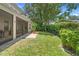 Lush backyard with a well-maintained lawn and mature landscaping perfect for outdoor activities and relaxation at 123 Ivydale Manor Dr, Deland, FL 32724