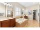 Luxurious bathroom featuring double sinks, a large soaking tub, a separate shower, and a walk-in closet at 123 Ivydale Manor Dr, Deland, FL 32724