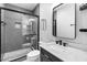 Modern bathroom with glass shower, marble counter, and sleek fixtures at 123 Ivydale Manor Dr, Deland, FL 32724