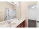Bright vanity with double sinks and a large mirror, accessing the bedroom at 123 Ivydale Manor Dr, Deland, FL 32724