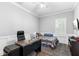 Functional bedroom with ample natural light, a desk, and a neutral color scheme at 123 Ivydale Manor Dr, Deland, FL 32724