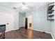Bedroom featuring wood floors, closet, and access to a private bathroom at 123 Ivydale Manor Dr, Deland, FL 32724