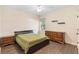 Neutral bedroom featuring wood floors, a window with blinds, and wooden dressers at 123 Ivydale Manor Dr, Deland, FL 32724