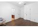 Bright bedroom featuring wood floors and access to a vanity and bathroom at 123 Ivydale Manor Dr, Deland, FL 32724