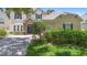 Charming home with stone accents, well-manicured landscaping, and a welcoming entrance, creating inviting curb appeal at 123 Ivydale Manor Dr, Deland, FL 32724