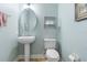 Cozy half bathroom featuring a pedestal sink, neutral paint, and tile flooring at 123 Ivydale Manor Dr, Deland, FL 32724
