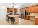 Spacious kitchen featuring stainless steel appliances, granite countertops, and a large center island with seating at 123 Ivydale Manor Dr, Deland, FL 32724