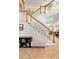 Bright foyer featuring a staircase with wooden bannister and white spindles at 123 Ivydale Manor Dr, Deland, FL 32724