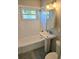 Modern bathroom featuring a white subway tile surround, new fixtures, and natural light at 1408 W Wellington Dr, Deltona, FL 32725
