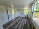 This bedroom boasts sleek plank flooring and bright natural light at 1408 W Wellington Dr, Deltona, FL 32725