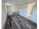 This bedroom boasts sleek plank flooring and bright natural light at 1408 W Wellington Dr, Deltona, FL 32725