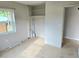 Clean bedroom featuring a closet with an adjacent window at 1408 W Wellington Dr, Deltona, FL 32725