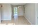 Bright living room boasting neutral walls and tile floors, offering a versatile living space at 1408 W Wellington Dr, Deltona, FL 32725