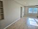 Open living room featuring light gray walls, tile floors and natural light at 1408 W Wellington Dr, Deltona, FL 32725