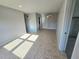 Bright living room with tiled floors, open layout, and neutral paint at 1408 W Wellington Dr, Deltona, FL 32725