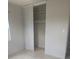 Open closet with shelves and clothes rod. This looks great at 1408 W Wellington Dr, Deltona, FL 32725