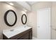 Bathroom featuring a double sink vanity with modern fixtures and recessed lighting at 14634 Brightwell Ct, Orlando, FL 32824