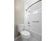 Clean bathroom showcasing a shower and tub combination, white subway tile and a window for natural light at 14634 Brightwell Ct, Orlando, FL 32824