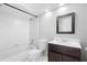 Classic bathroom with dark wood vanity, toilet, tub and tiled shower combo at 14634 Brightwell Ct, Orlando, FL 32824
