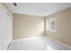 Clean, bright bedroom with white tile floors, a window, and a closet with sliding doors at 14634 Brightwell Ct, Orlando, FL 32824