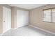 Bright bedroom with white tiled floors, closet with sliding doors, and window at 14634 Brightwell Ct, Orlando, FL 32824