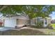 Charming home featuring a well-maintained lawn and a two-car garage at 14634 Brightwell Ct, Orlando, FL 32824