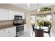Bright kitchen features modern appliances and a cozy breakfast nook at 14634 Brightwell Ct, Orlando, FL 32824