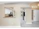 Open-concept view showcases white kitchen cabinets, granite countertops, and modern stainless steel appliances at 14634 Brightwell Ct, Orlando, FL 32824