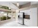 Bright and airy kitchen with stainless steel fridge and white cabinetry at 14634 Brightwell Ct, Orlando, FL 32824