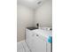 Laundry room featuring modern, white Maytag washer and dryer at 14634 Brightwell Ct, Orlando, FL 32824