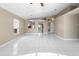 Open-concept living area with tile flooring and view of the kitchen at 14634 Brightwell Ct, Orlando, FL 32824