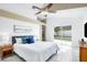 Spacious main bedroom with tile flooring, sliding glass door access to pool, and ensuite bathroom at 14634 Brightwell Ct, Orlando, FL 32824