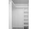 Bright white walk-in closet featuring built-in shelving and hanging rod at 14634 Brightwell Ct, Orlando, FL 32824