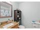 Charming bathroom with a granite vanity and a decorative shower curtain at 149 Angeles Rd, Debary, FL 32713