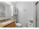 Well-lit bathroom featuring a granite countertop and storage at 149 Angeles Rd, Debary, FL 32713