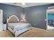 Comfortable bedroom showcasing a statement headboard and soothing color palette at 149 Angeles Rd, Debary, FL 32713