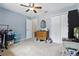 Spacious bedroom with a ceiling fan, dresser, and ample storage at 149 Angeles Rd, Debary, FL 32713