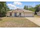 Charming single-story home featuring a well-maintained lawn and attached two-car garage at 149 Angeles Rd, Debary, FL 32713