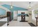 Bright kitchen featuring granite counters, white cabinets, and stainless steel appliances at 149 Angeles Rd, Debary, FL 32713