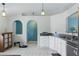 Bright kitchen featuring granite counters, white cabinets, and stainless steel appliances at 149 Angeles Rd, Debary, FL 32713